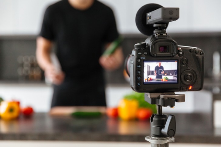 social media marketing influencer filming a cookery show